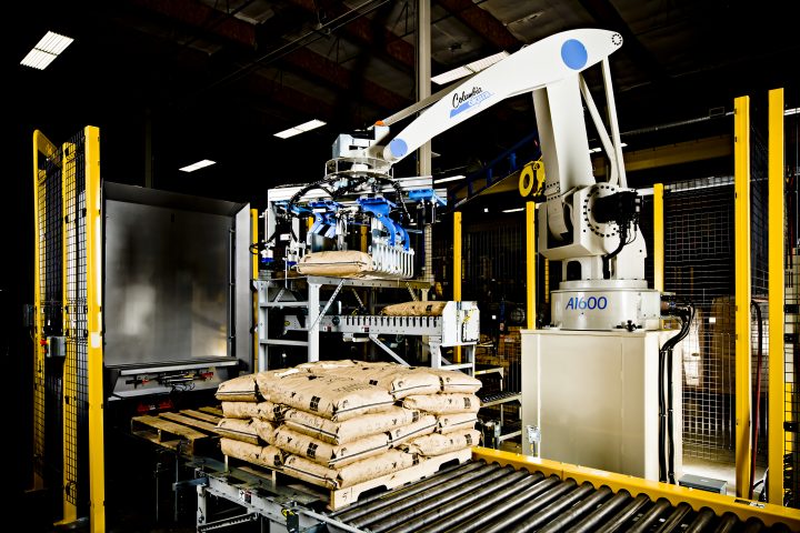 Image of a Columbia Okura Robotic Palletizer stacking bags.